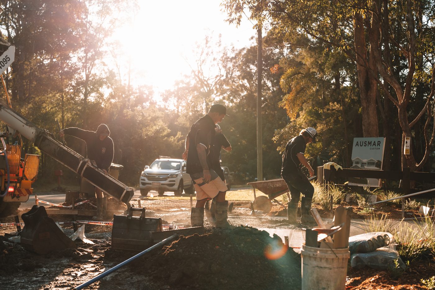 Placing concrete into the forms at first light