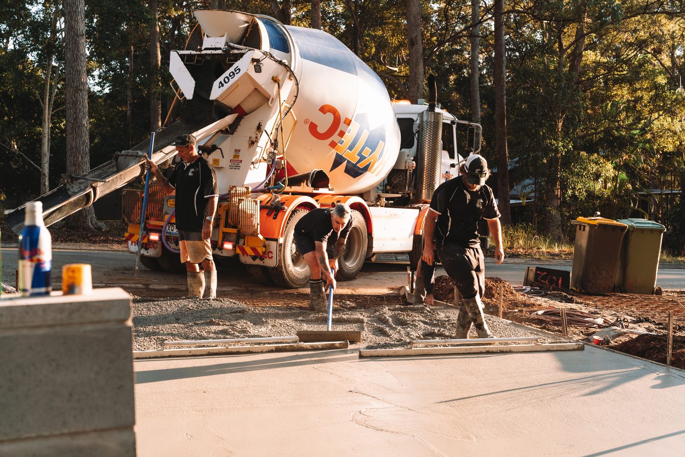Concrete truck placing a wide driveway slab
