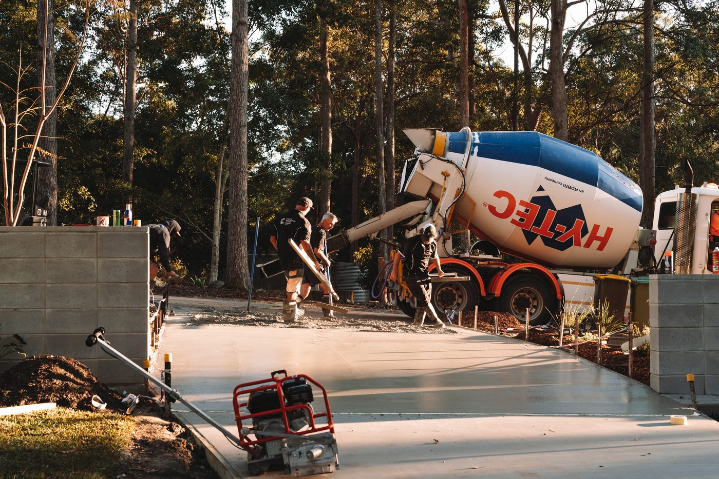 Concrete truck placing a residential slab pour on a new build site
