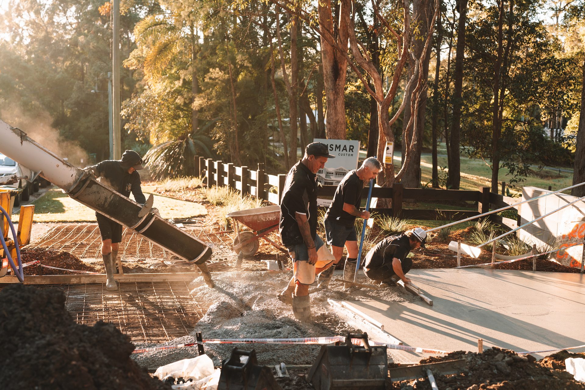 Creativ Concrete crew placing and screeding a residential house slab