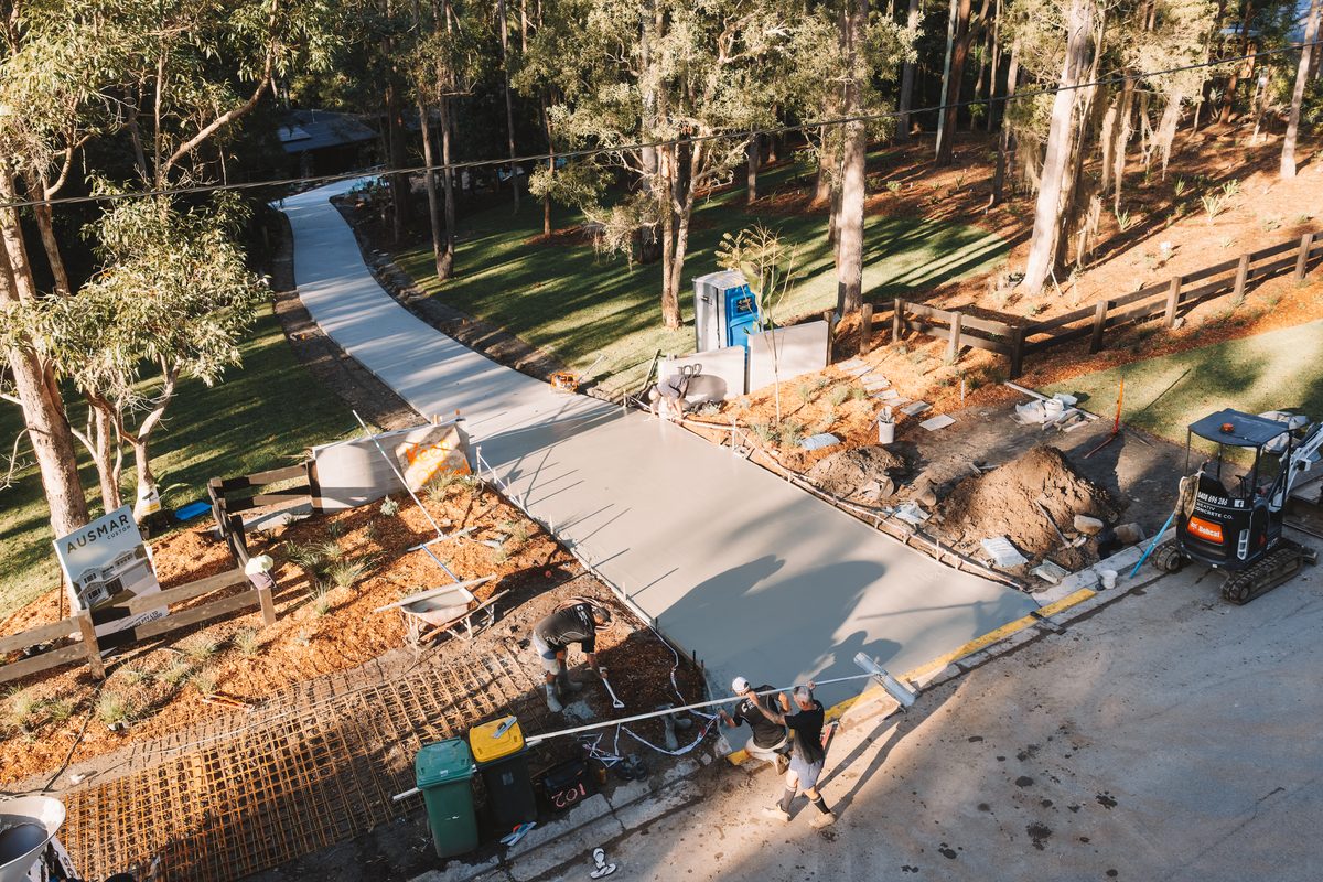 Aerial view of a long driveway pour in progress